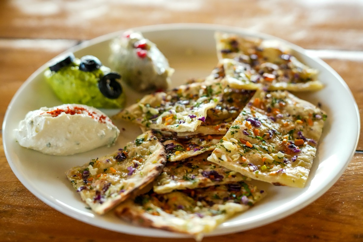 Traditional Jordanian mezze spread with hummus, flatbread and olives
