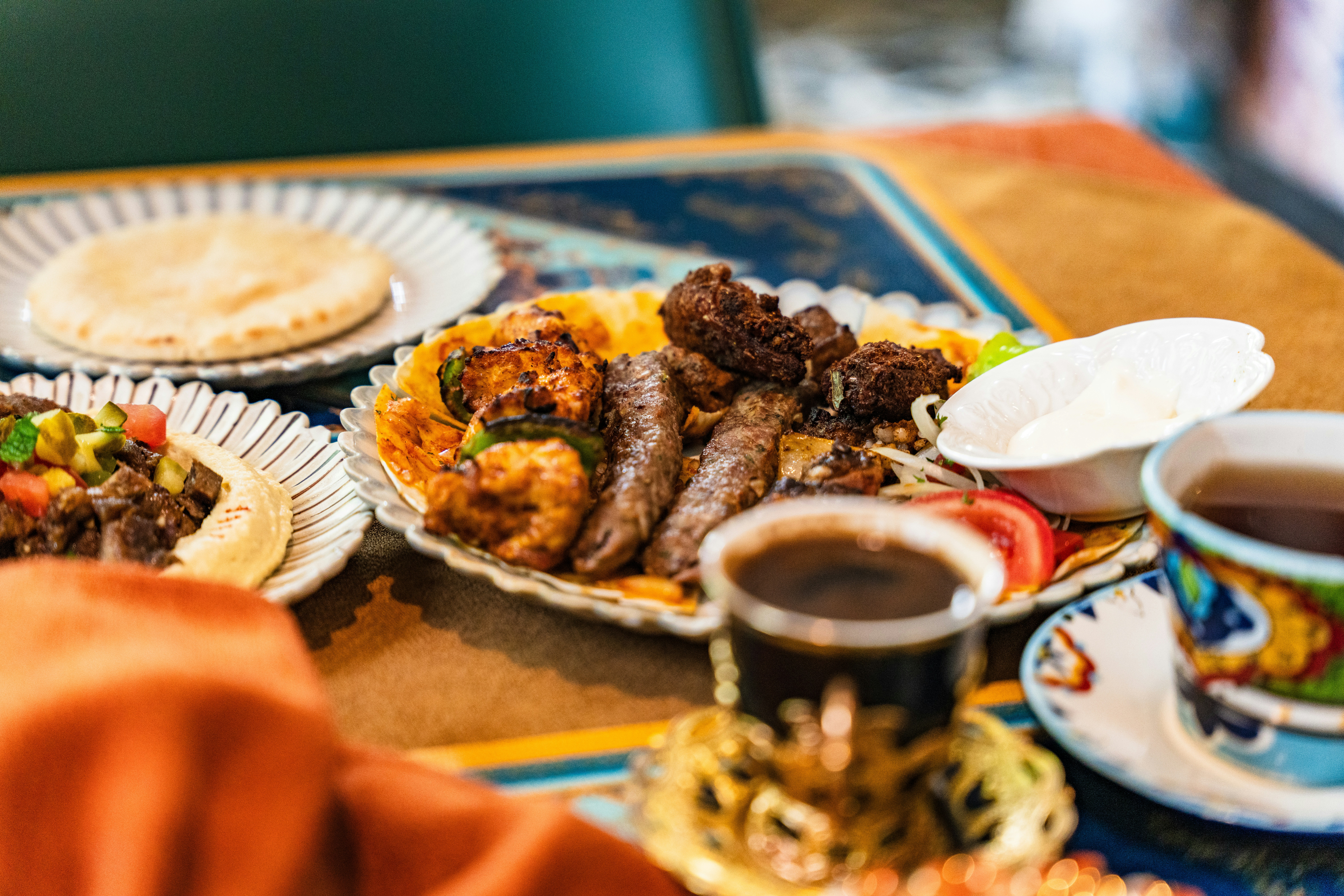 Platter of grilled meats with rice and pita bread at a Middle Eastern restaurant