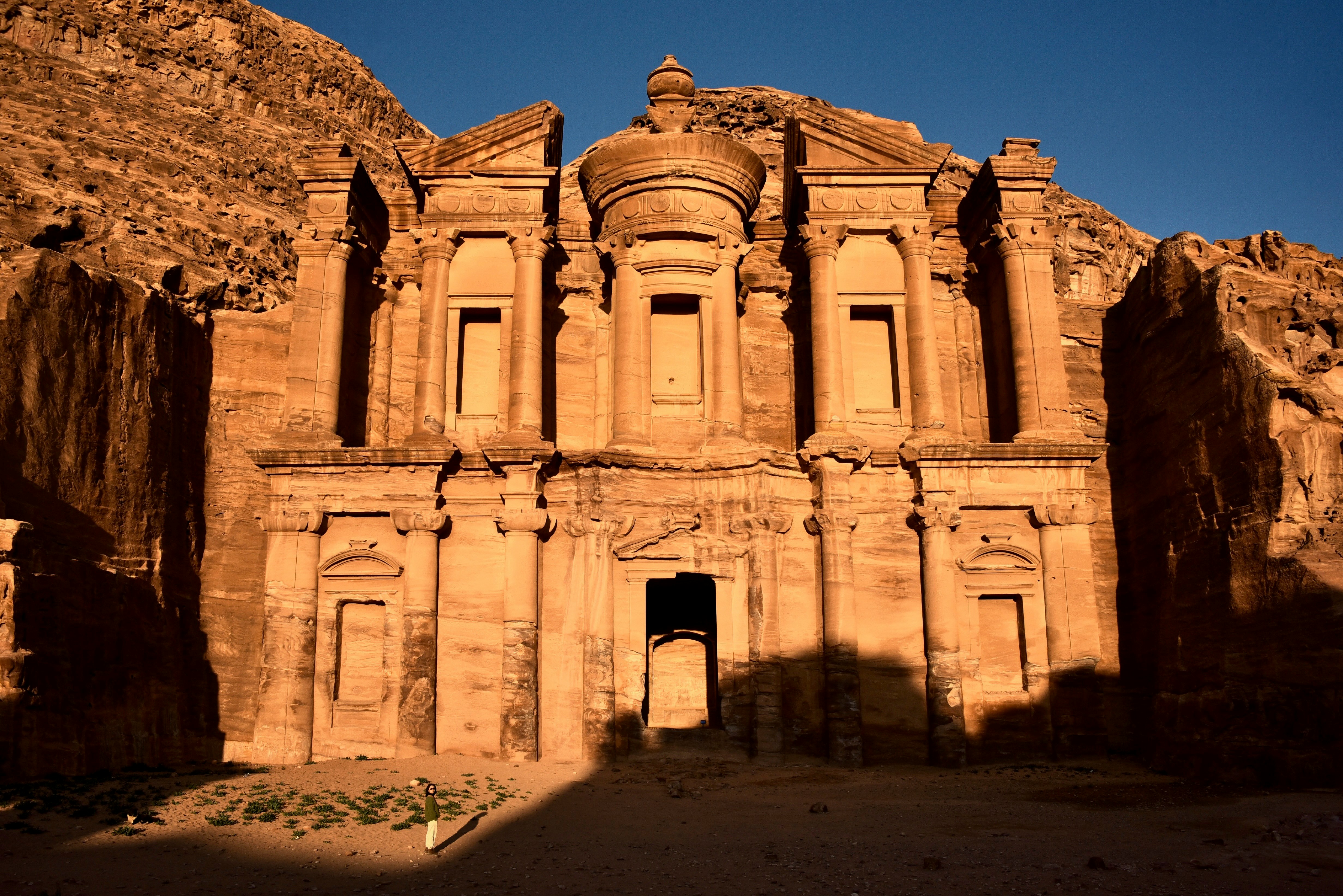 The Monastery at Petra, a grand facade carved into rose-red sandstone cliffs in Jordan