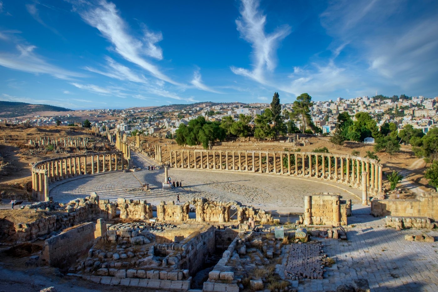Tall Roman columns lining the Cardo Maximus colonnaded street at Jerash, Jordan
