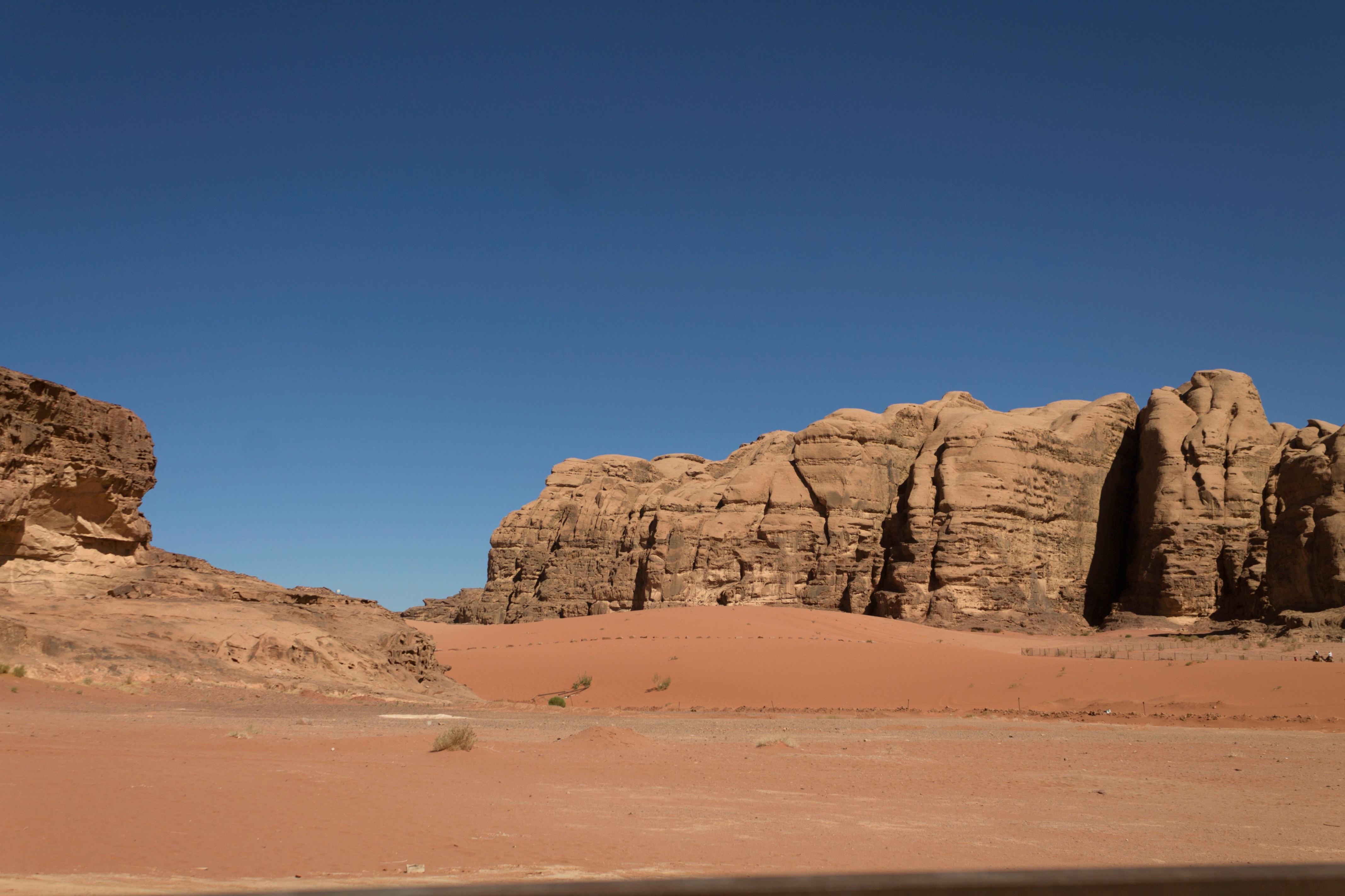 Petra Treasury carved into rose-red sandstone cliffs in Jordan