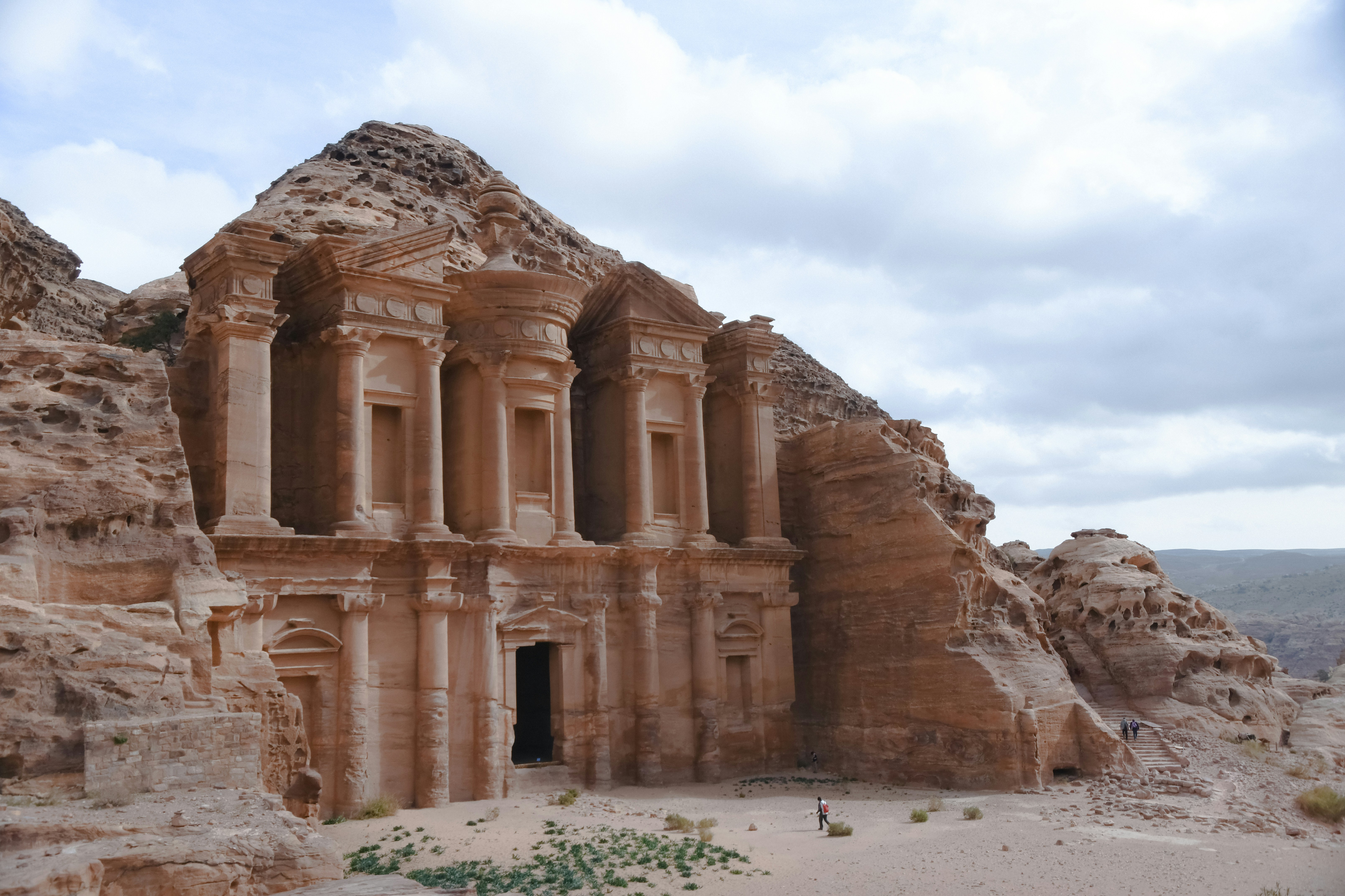 Petra Treasury carved into rose-red sandstone cliffs in Jordan