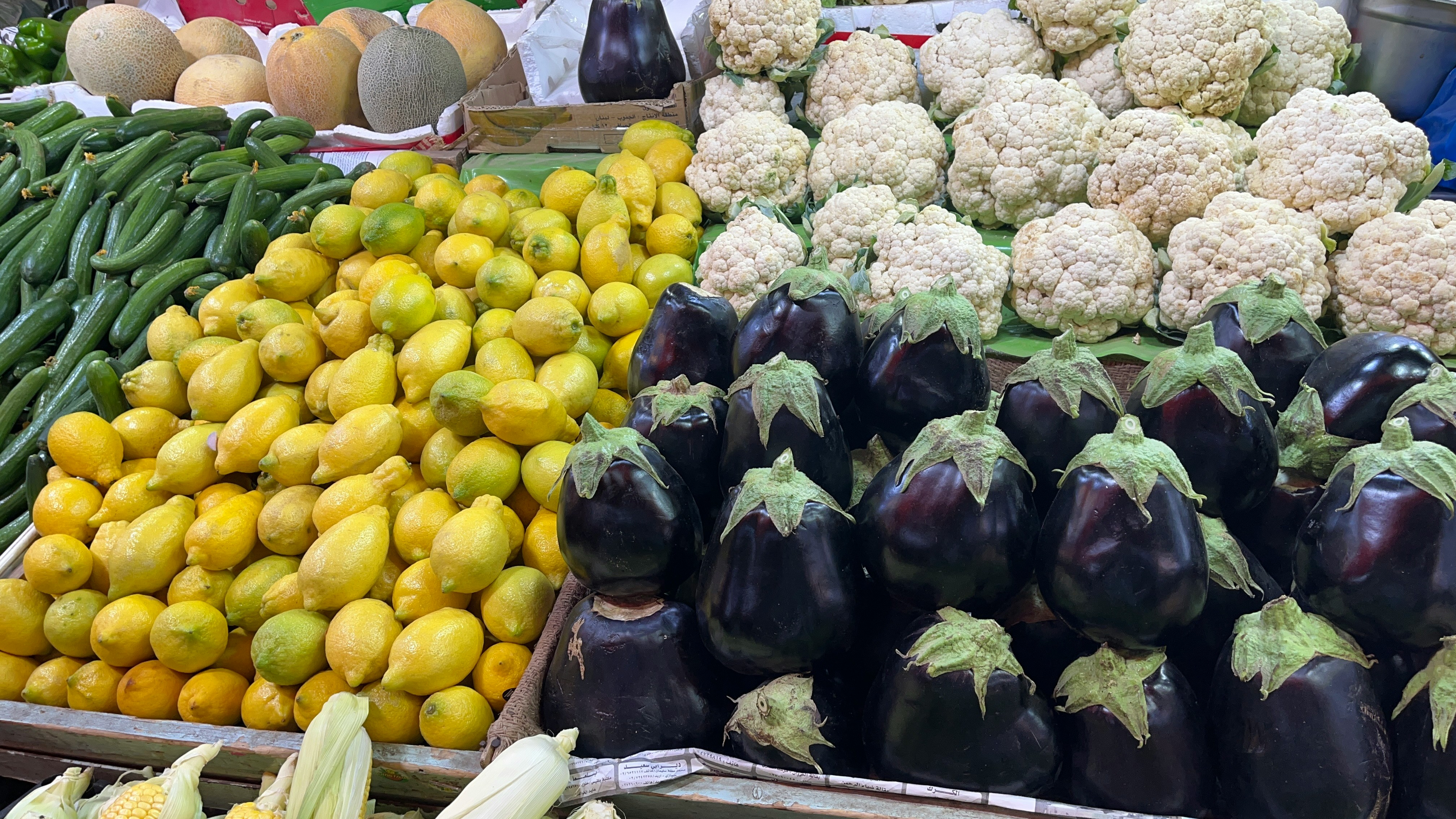 Fresh produce stalls at a market in Amman, Jordan — cash is standard at local markets