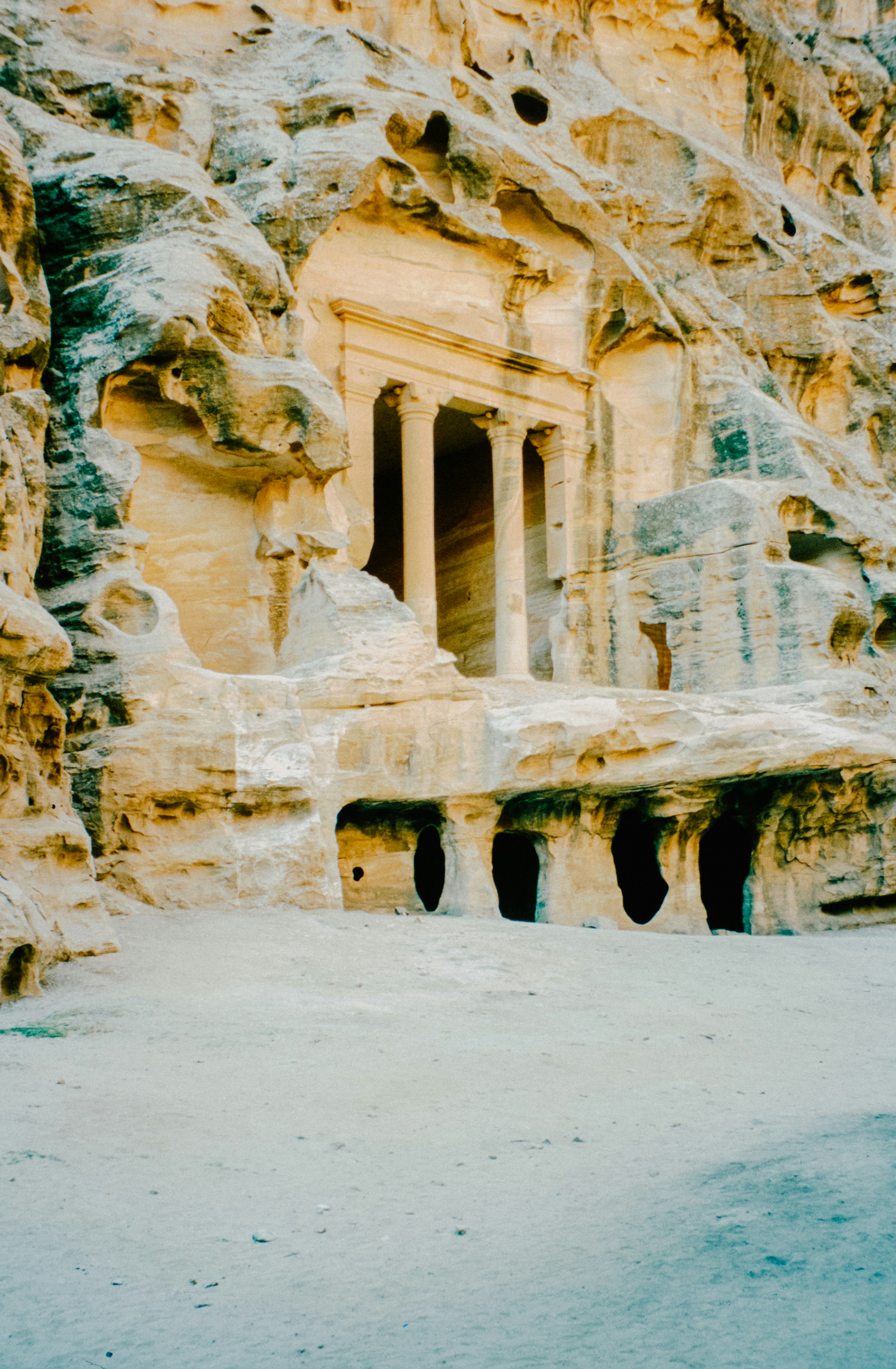 Petra Treasury carved into rose-red sandstone cliffs in Jordan