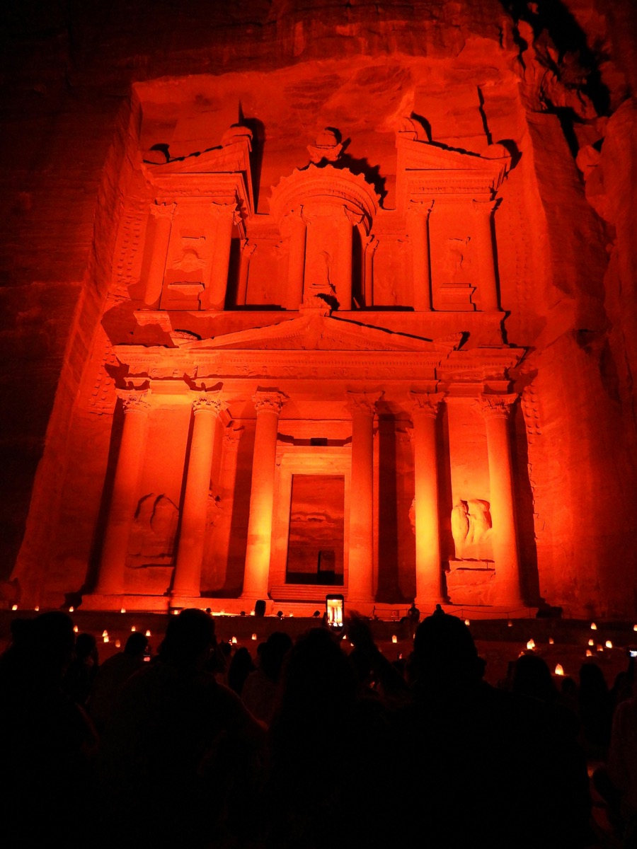 The Treasury at Petra illuminated by hundreds of candles on a dark night