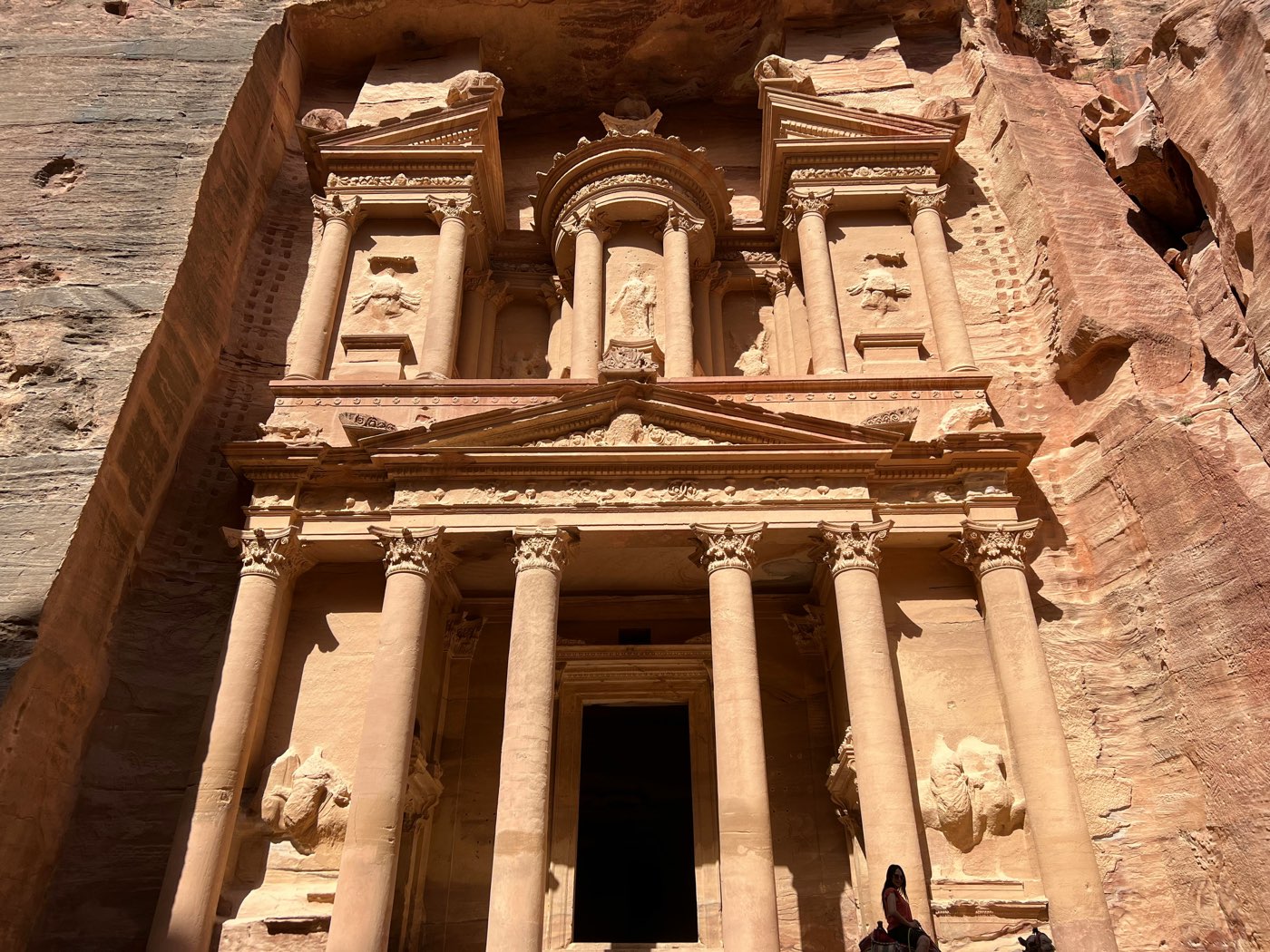 The Petra Treasury facade up close, with ornate carved columns and figures